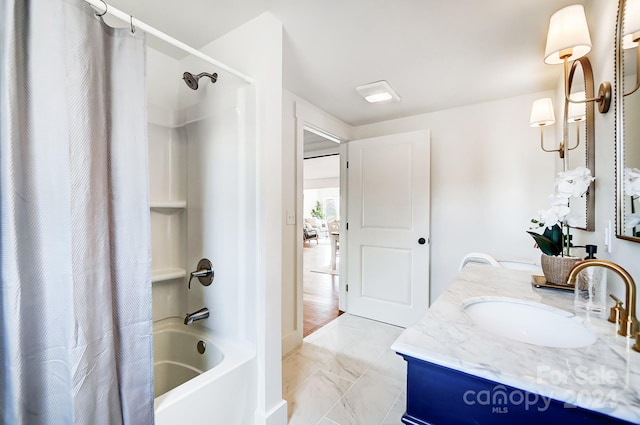 bathroom with shower / tub combo with curtain and vanity