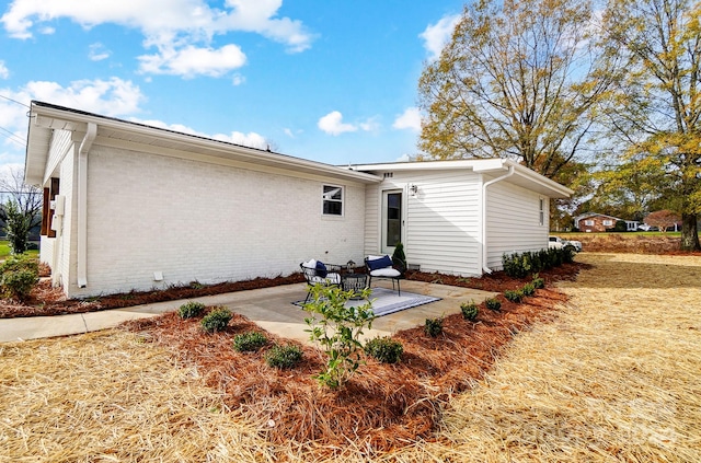 back of property with a patio area