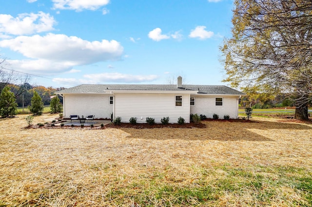 rear view of property featuring a patio