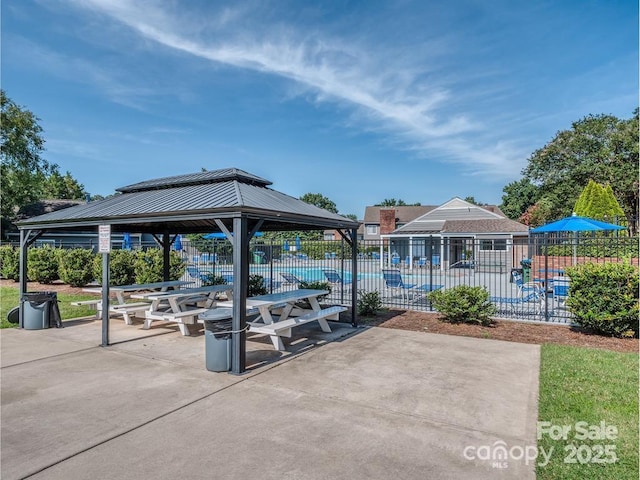 view of patio / terrace featuring a gazebo and a community pool