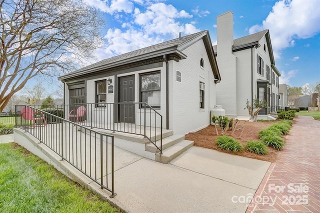 view of front of house featuring a sunroom