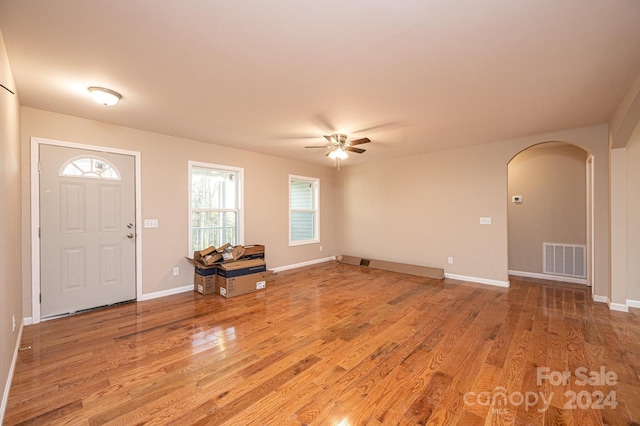 entryway with ceiling fan and light hardwood / wood-style floors