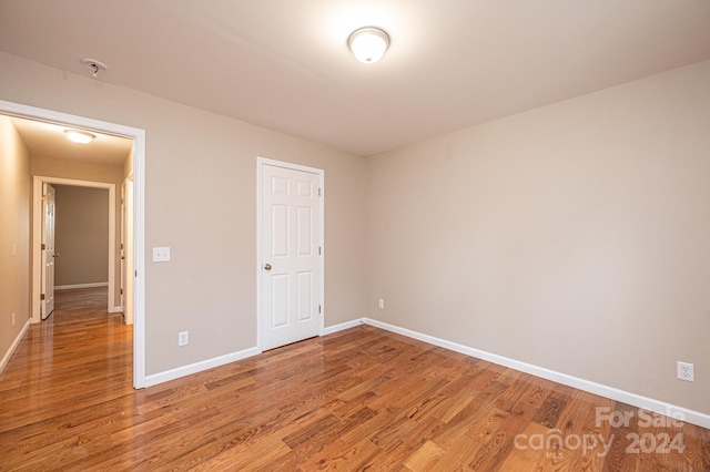 unfurnished bedroom with wood-type flooring