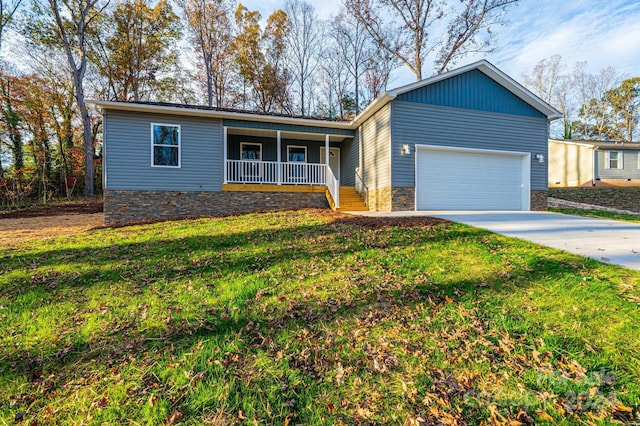 single story home featuring a front yard, a porch, and a garage