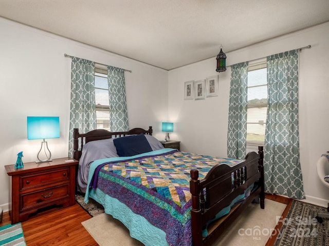 bedroom featuring hardwood / wood-style floors