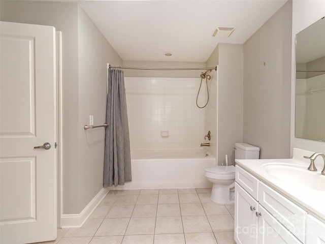 full bathroom featuring tile patterned floors, vanity, toilet, and shower / bath combo with shower curtain