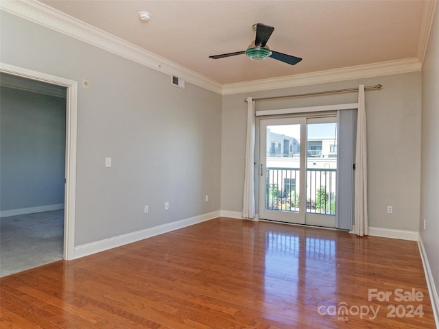 spare room with ceiling fan, crown molding, and wood-type flooring