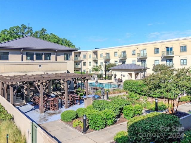 surrounding community with a pergola