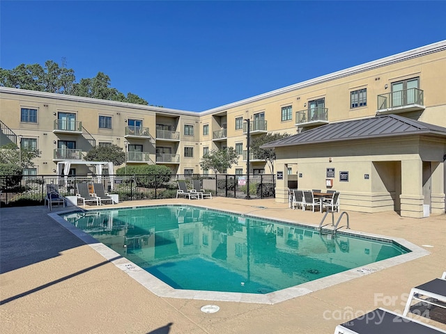 view of pool featuring a patio area