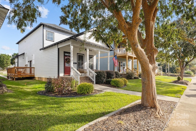 view of front of home with a front yard and a porch