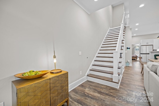 staircase featuring hardwood / wood-style flooring