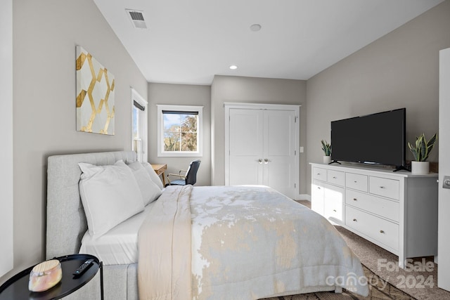 carpeted bedroom featuring a closet