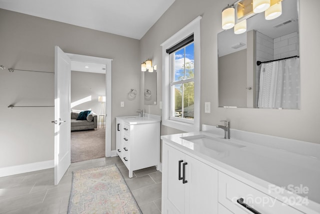 bathroom with vanity and tile patterned floors