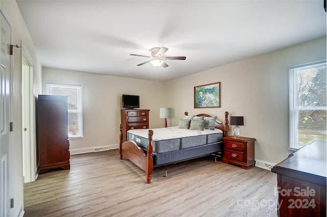 bedroom featuring light hardwood / wood-style flooring and ceiling fan