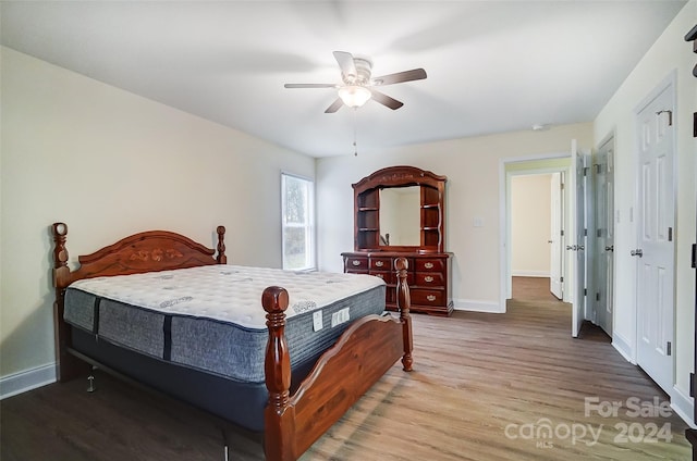 bedroom featuring hardwood / wood-style flooring and ceiling fan