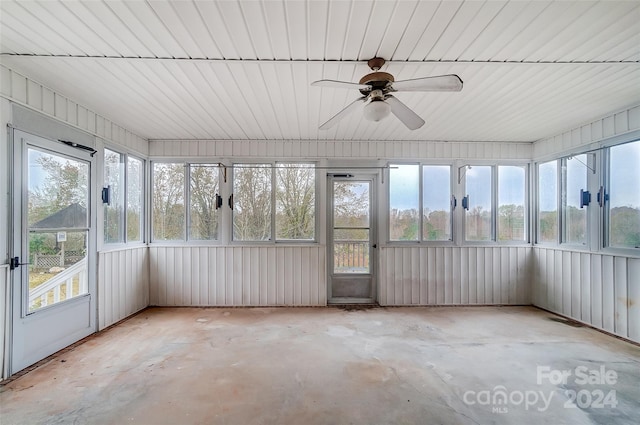 unfurnished sunroom with ceiling fan