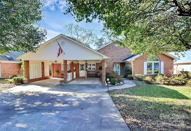 1811 Charter Dr, Rock Hill, SC 29732 - view of front of property featuring brick siding, asphalt driveway, a ceiling fan, and a carport