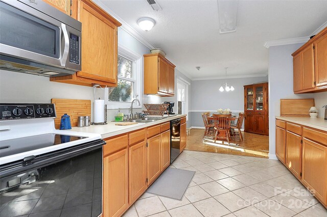 1811 Charter Dr, Rock Hill, SC 29732 - kitchen with stainless steel microwave, electric stove, a sink, dishwasher, and crown molding