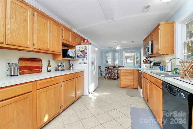 kitchen with white appliances, sink, ceiling fan, ornamental molding, and light tile patterned floors