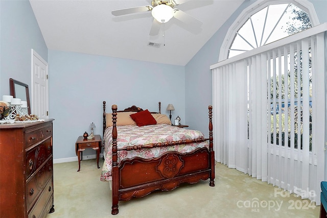 bedroom with light carpet, vaulted ceiling, and ceiling fan