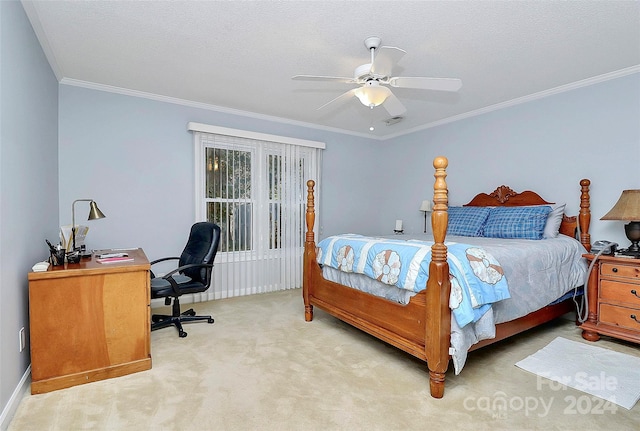 carpeted bedroom featuring a textured ceiling, ceiling fan, and crown molding