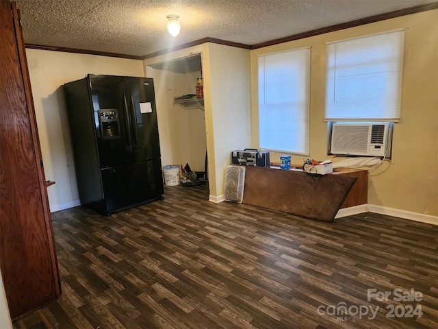 interior space featuring dark hardwood / wood-style flooring, a textured ceiling, and black refrigerator with ice dispenser