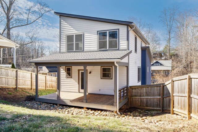 back of property featuring a deck