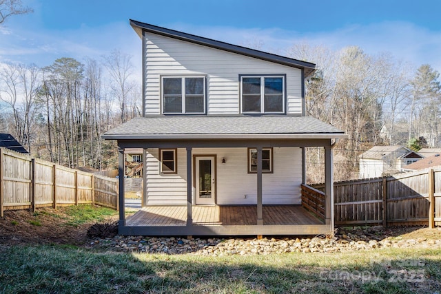 rear view of house featuring a deck