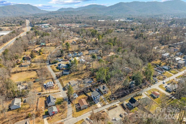 birds eye view of property featuring a mountain view