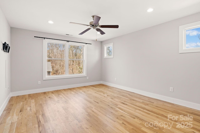 empty room with light hardwood / wood-style floors and ceiling fan