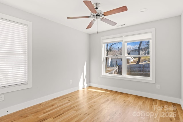 empty room featuring light hardwood / wood-style flooring and ceiling fan