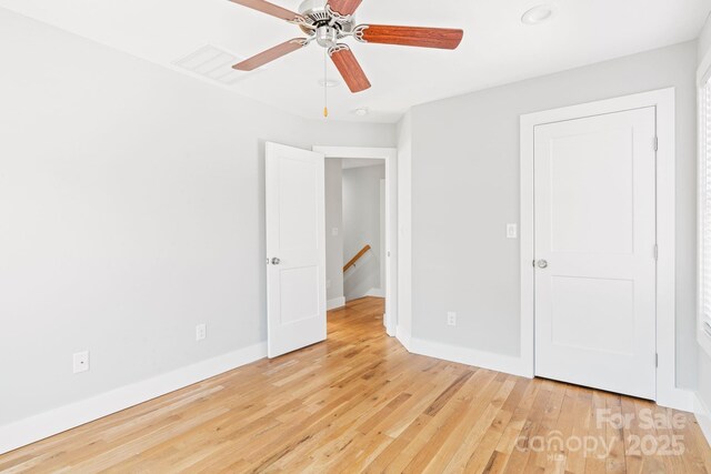 unfurnished bedroom featuring ceiling fan and light wood-type flooring