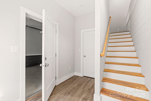 staircase featuring hardwood / wood-style floors