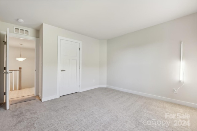 unfurnished bedroom featuring carpet