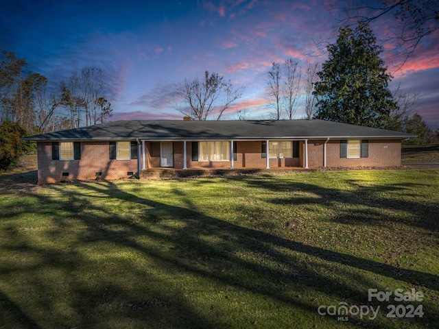 view of front of property with a yard