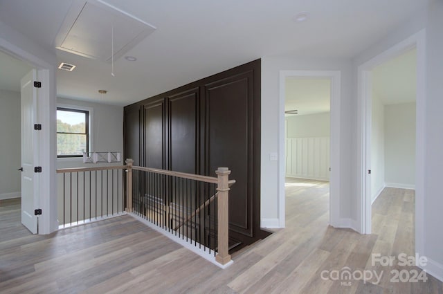 hallway with light hardwood / wood-style flooring