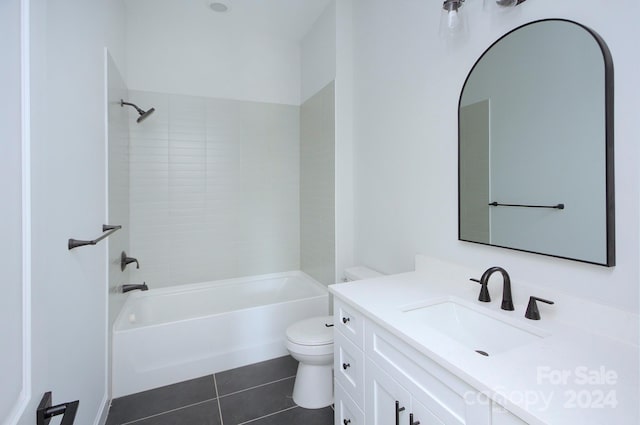 full bathroom with vanity, tile patterned flooring, tiled shower / bath, and toilet