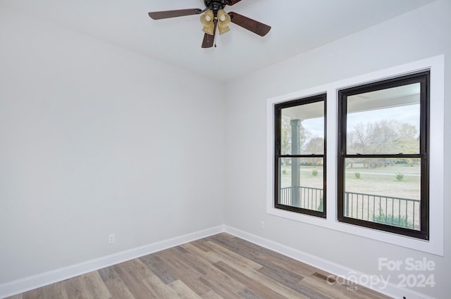 unfurnished room featuring ceiling fan and light wood-type flooring