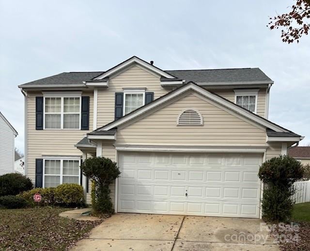 front facade with a garage