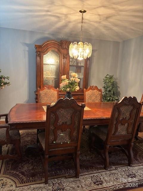 dining room featuring a notable chandelier