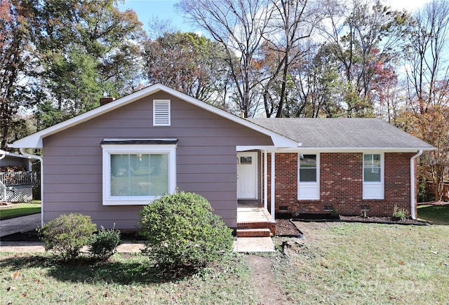 ranch-style home with a front lawn