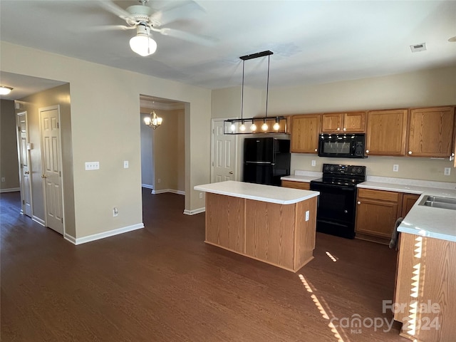 kitchen with a center island, dark hardwood / wood-style flooring, pendant lighting, black appliances, and ceiling fan with notable chandelier