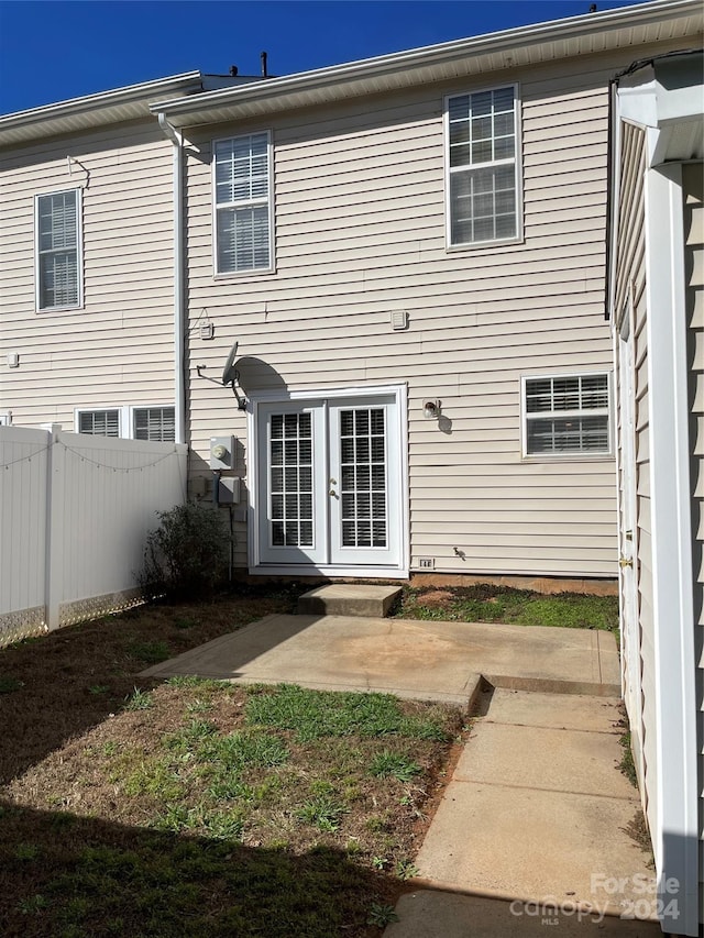 back of property with french doors and a patio