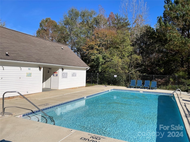 view of pool featuring a patio area