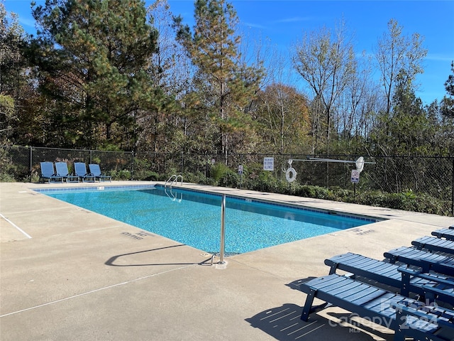 view of pool featuring a patio area