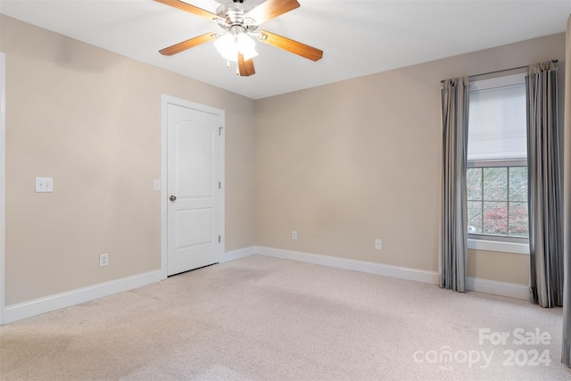 carpeted empty room with ceiling fan