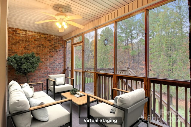 unfurnished sunroom with ceiling fan and wood ceiling