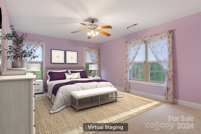 bedroom featuring ceiling fan and light colored carpet