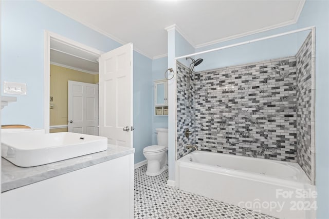 full bathroom with vanity, tile patterned floors, tiled shower / bath, toilet, and ornamental molding