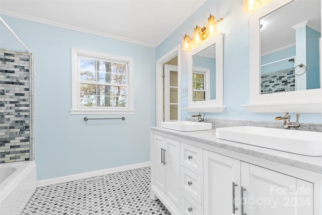 bathroom featuring vanity, tile patterned floors, tiled shower / bath, and crown molding